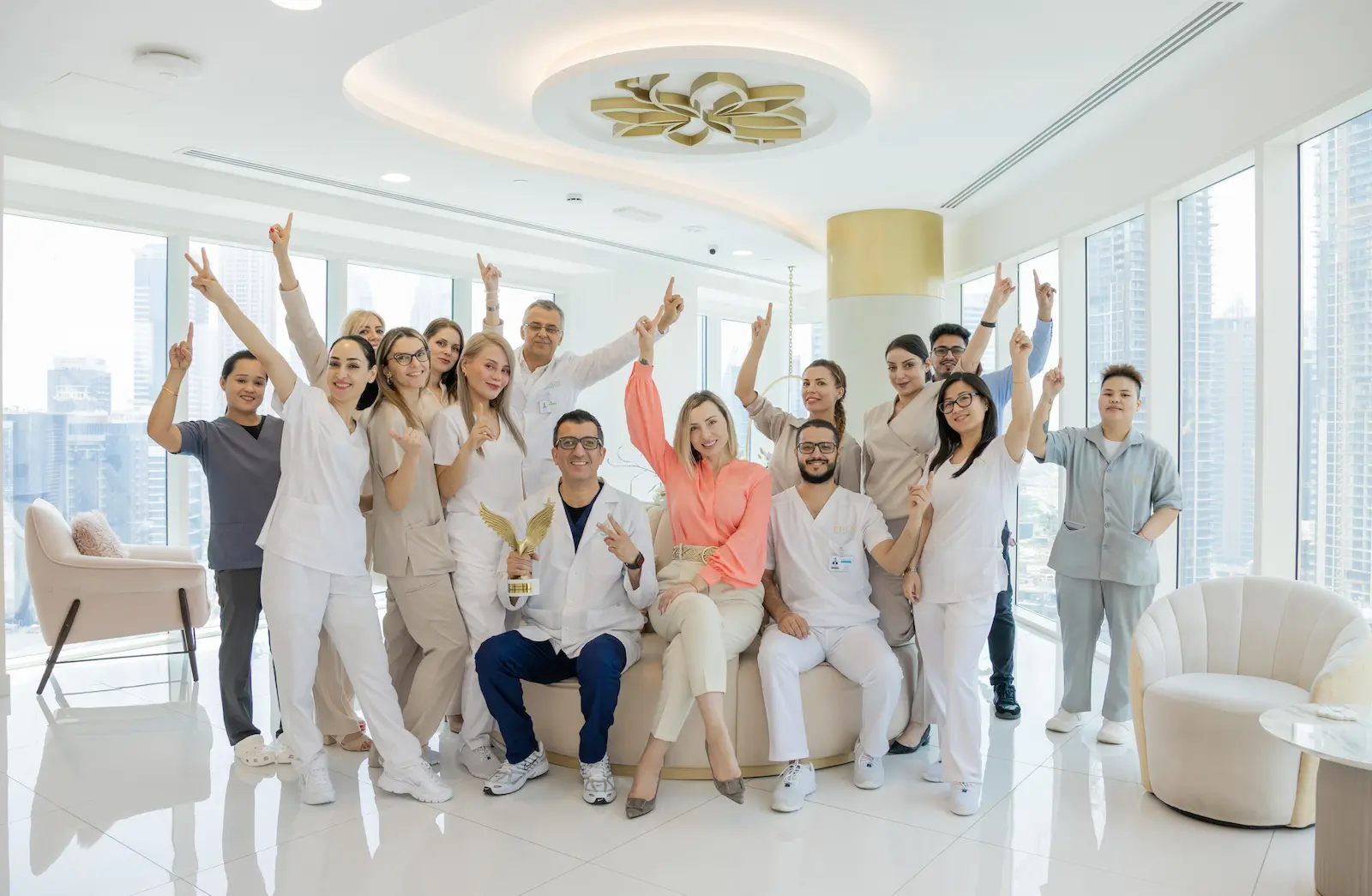 Placeholder group photo of the clinic team in uniform, gathered in a bright reception room